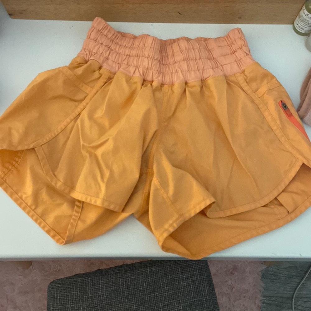 Orange lululemon tracker shorts
